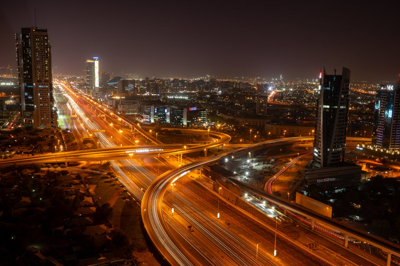 heros-img A breathtaking view of Dubai's vibrant skyline and illuminated roads at night, showcasing modern urban architecture.